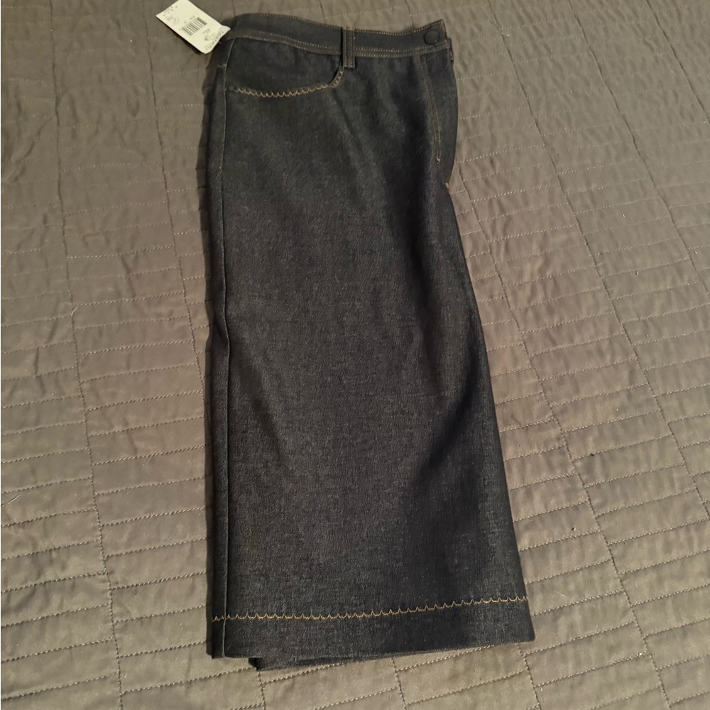 Tahari denim skirt with detail. Size 12. Made in Italy. Snap closure.